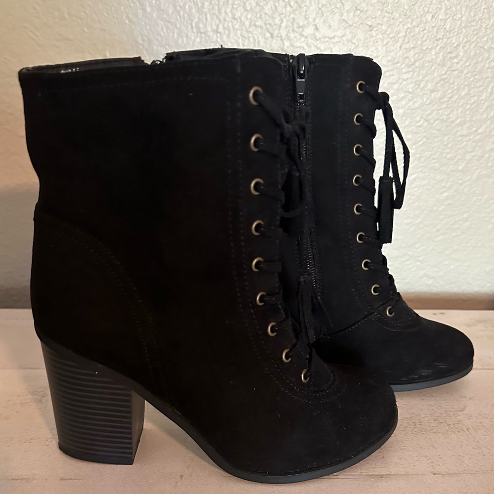 Black suede boots with zipper.